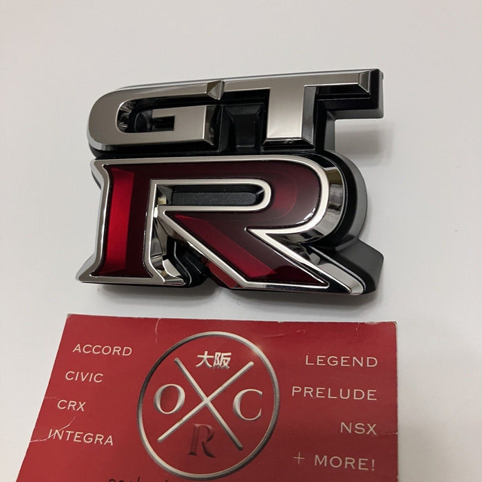 New Genuine OEM 2009-2024 Nissan GT-R Front Grille Emblem Badge 62892-JF60A R35