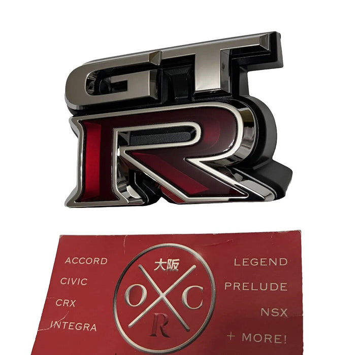 New Genuine OEM 2009-2024 Nissan GT-R Front Grille Emblem Badge 62892-JF60A R35